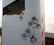 Bullet holes in speed camera