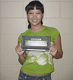 Kimora booking photo, July 2004