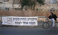 Anti-Olmert sign