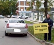 Todd Dube holds warning sign